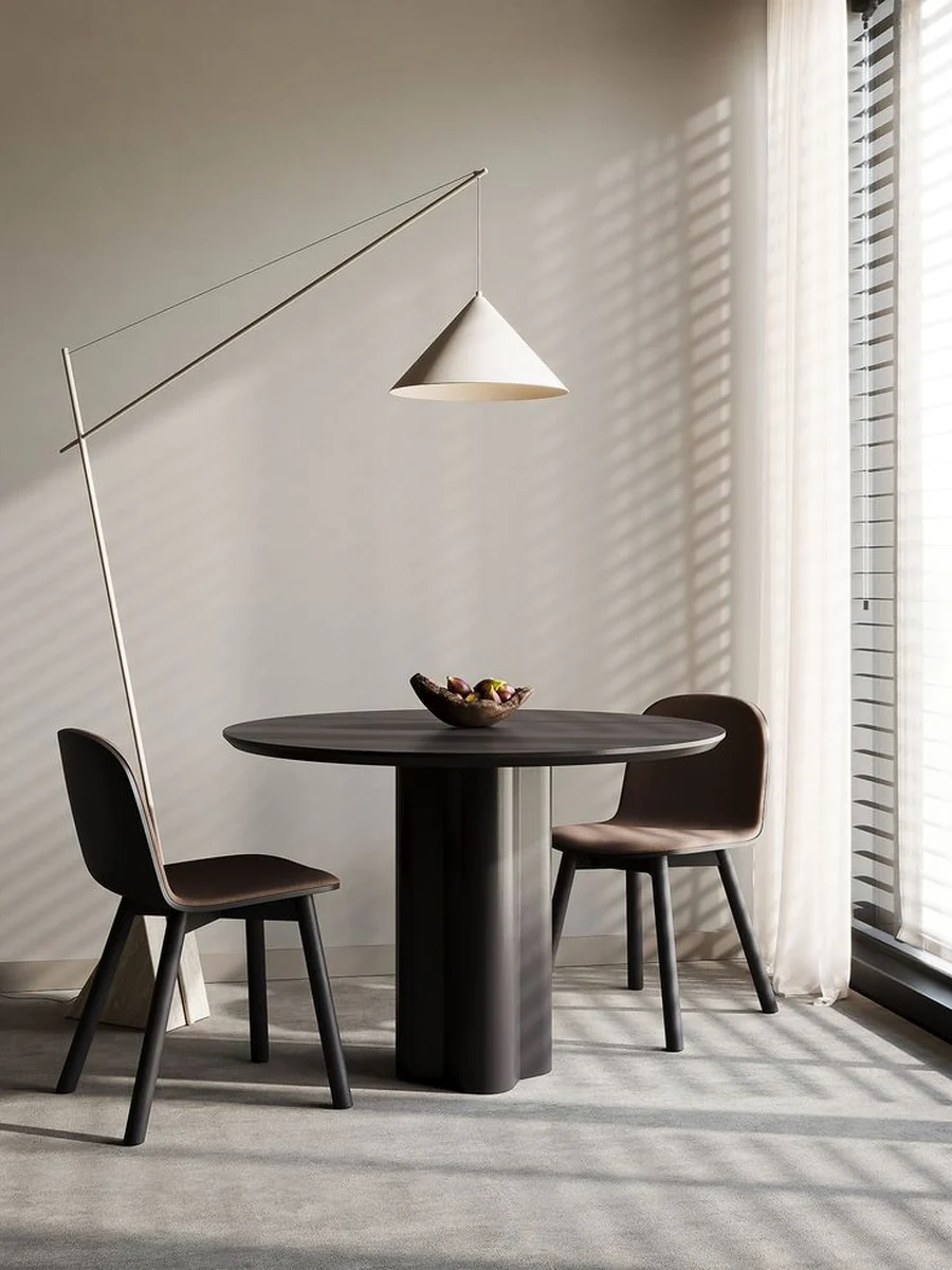 CGI lifestyle render of a round dining table and chairs under an arc lamp
