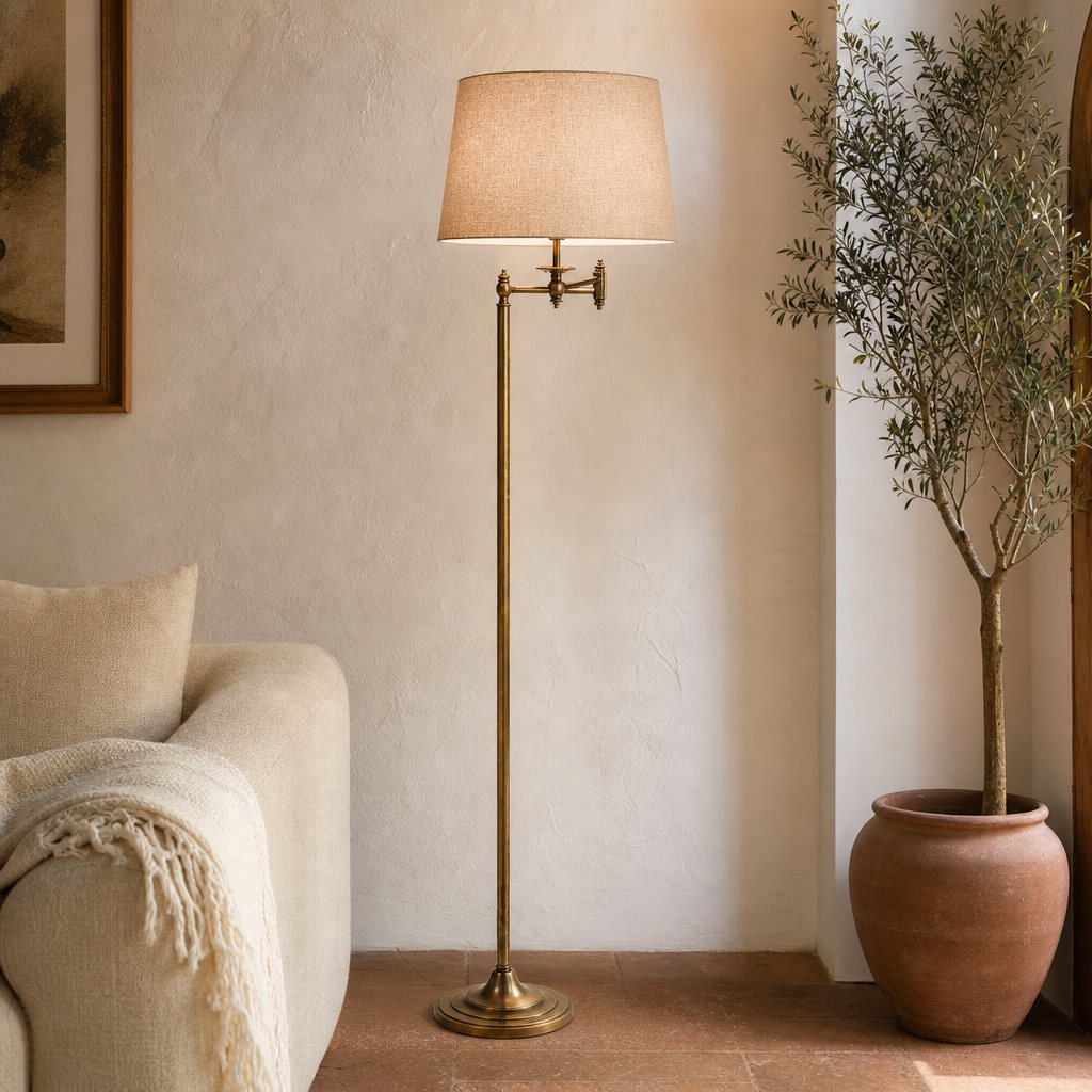 AI lifestyle scene, a brass floor lamp with a linen shade beside a sofa