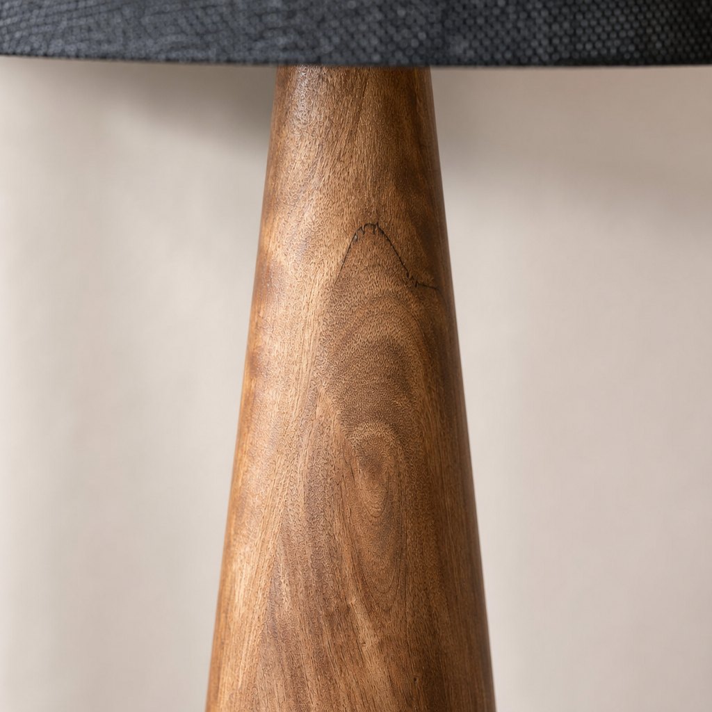 AI lifestyle scene, close detail of the turned timber grain under the black shade