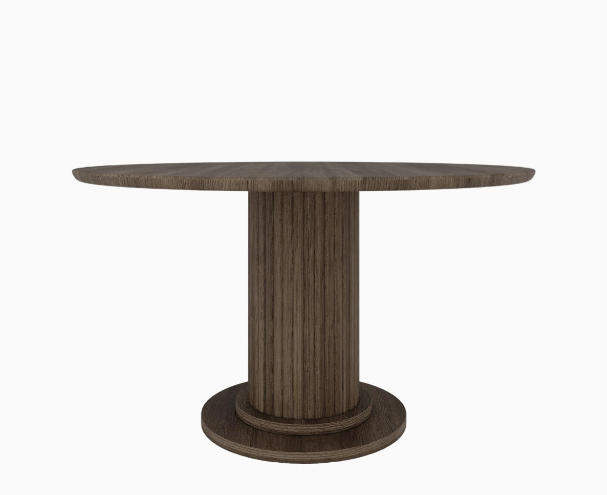 Callix round table with a fluted pedestal, the product photo supplied by the brand