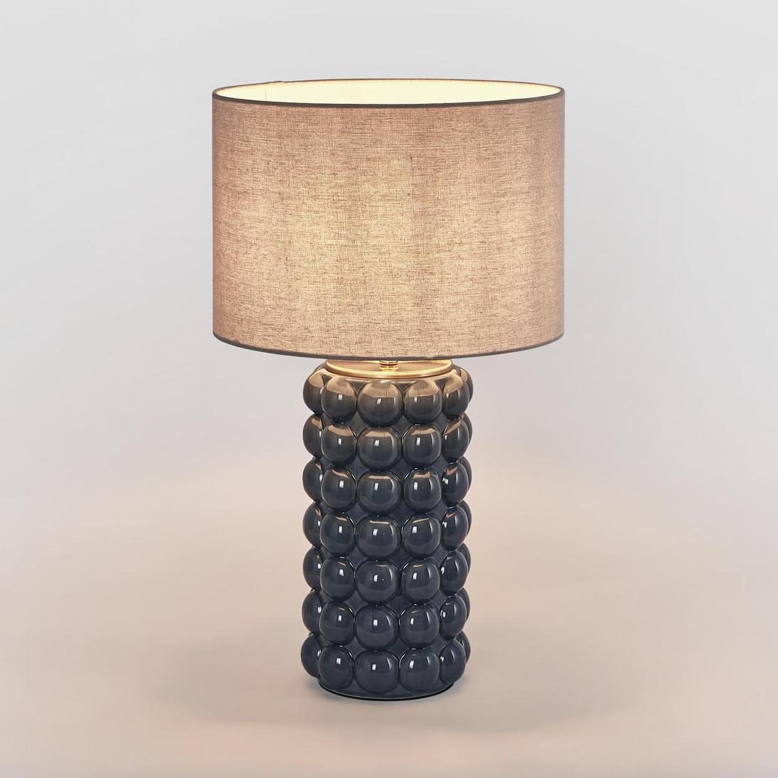 Condotti table lamp with a blue glazed base and linen shade, the product photo supplied by the brand