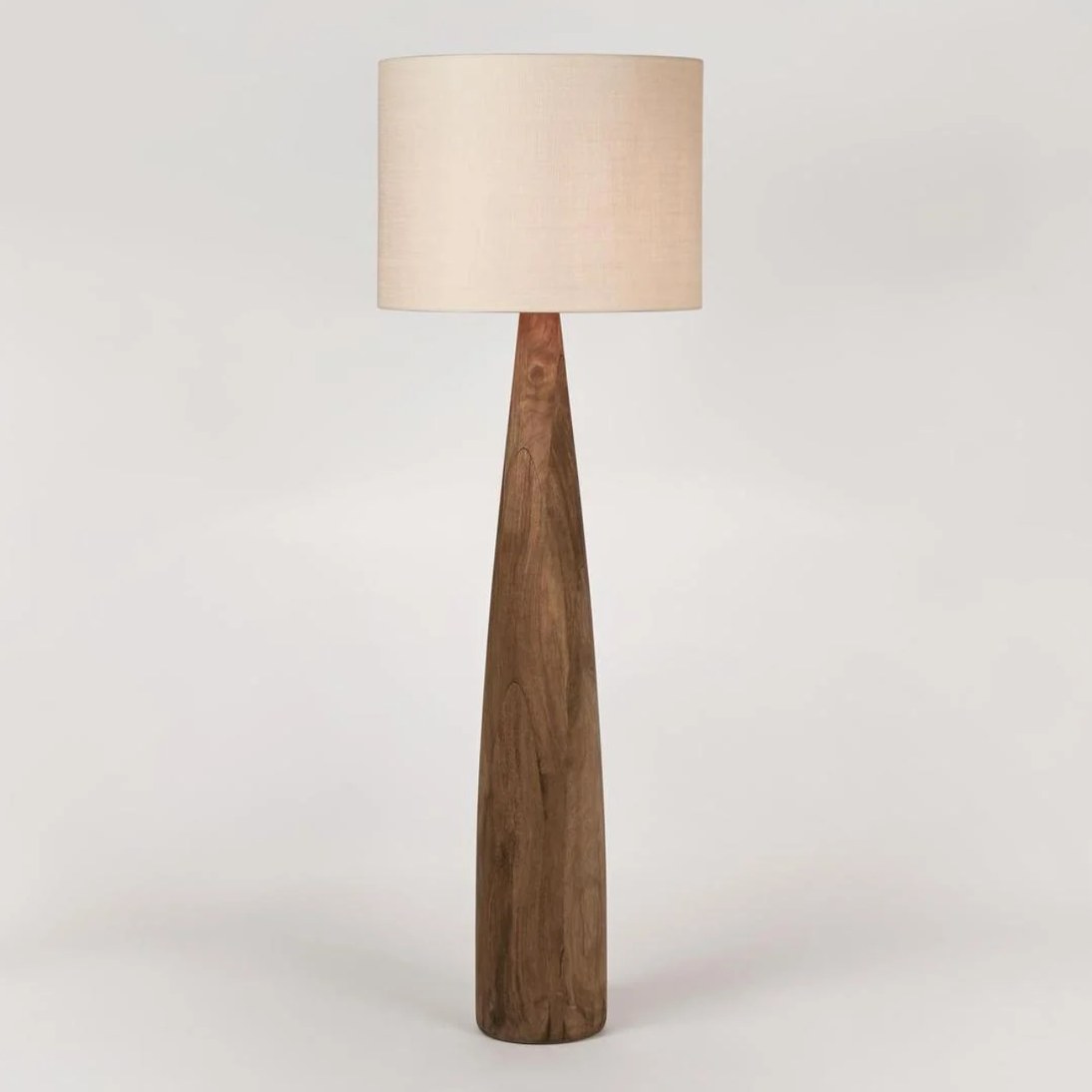 Samson wood floor lamp with saddle base and natural linen shade, the product photo supplied by the brand
